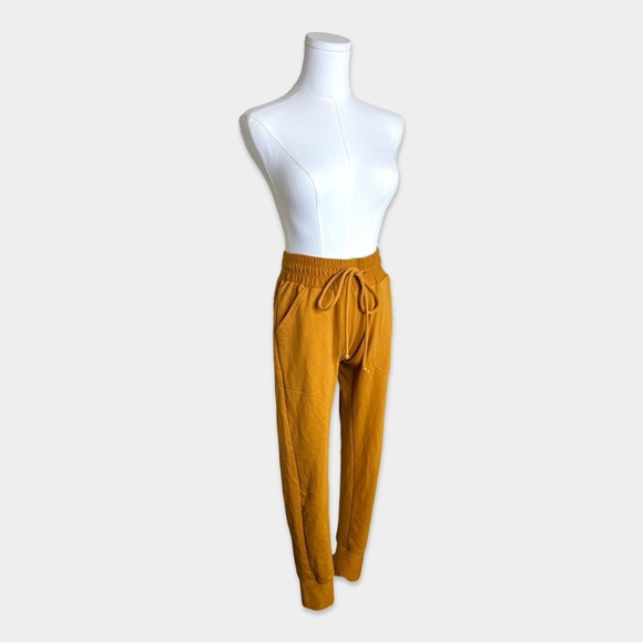 Free People Pants - 47. FREE PEOPLE MOVEMENT Joggers Size XS Orange Yellow Color